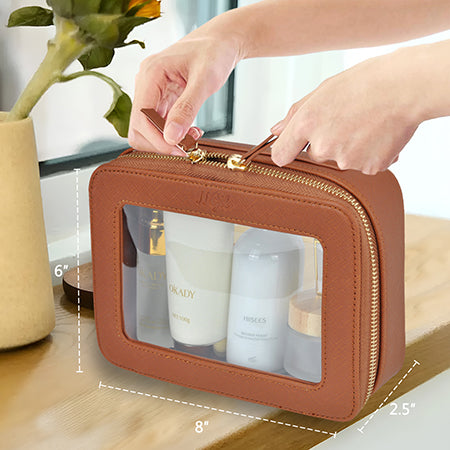 clear toiletry bag, faux leather makeup bag, TSA approved toiletry bag, clear cosmetic pouch, travel toiletry organizer, transparent makeup bag, waterproof travel bag, vegan leather toiletry bag, gym cosmetic bag, cruise travel bag, dance competition toiletry bag, road trip makeup case, golden zipper cosmetic bag, stylish clear bag, skincare travel pouch, TSA clear bag, eco-friendly cosmetic bag, clear bag with gold accents, makeup travel pouch, beauty storage organizer