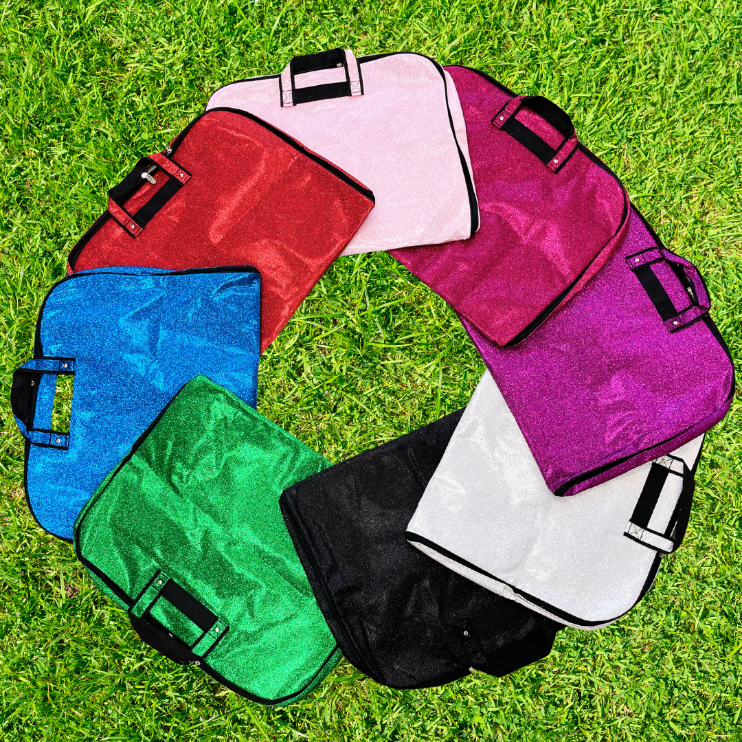 royal glitter garment bag, NGIL garment bag, dance garment bag, cheer garment bag, travel garment bag, competition garment bag, dancewear storage bag, wrinkle-free travel bag, glitter travel bag, dancer travel bag, cheerleader travel bag, monogram garment bag, foldable garment bag, lightweight dance bag, dance competition bag, glitter cheer bag, garment bag with hook, glitter clothing bag, sparkly garment bag, stylish travel bag, costume storage bag, dance outfit bag, cheer uniform bag